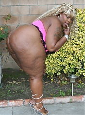 Thunder Katt exposes her massive folds of fat and enormous black ass during a live cam show