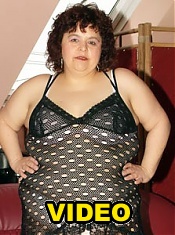 Redhead plumper Gaborne lets her big boobs hang while she dips a dildo inside her fat snatch